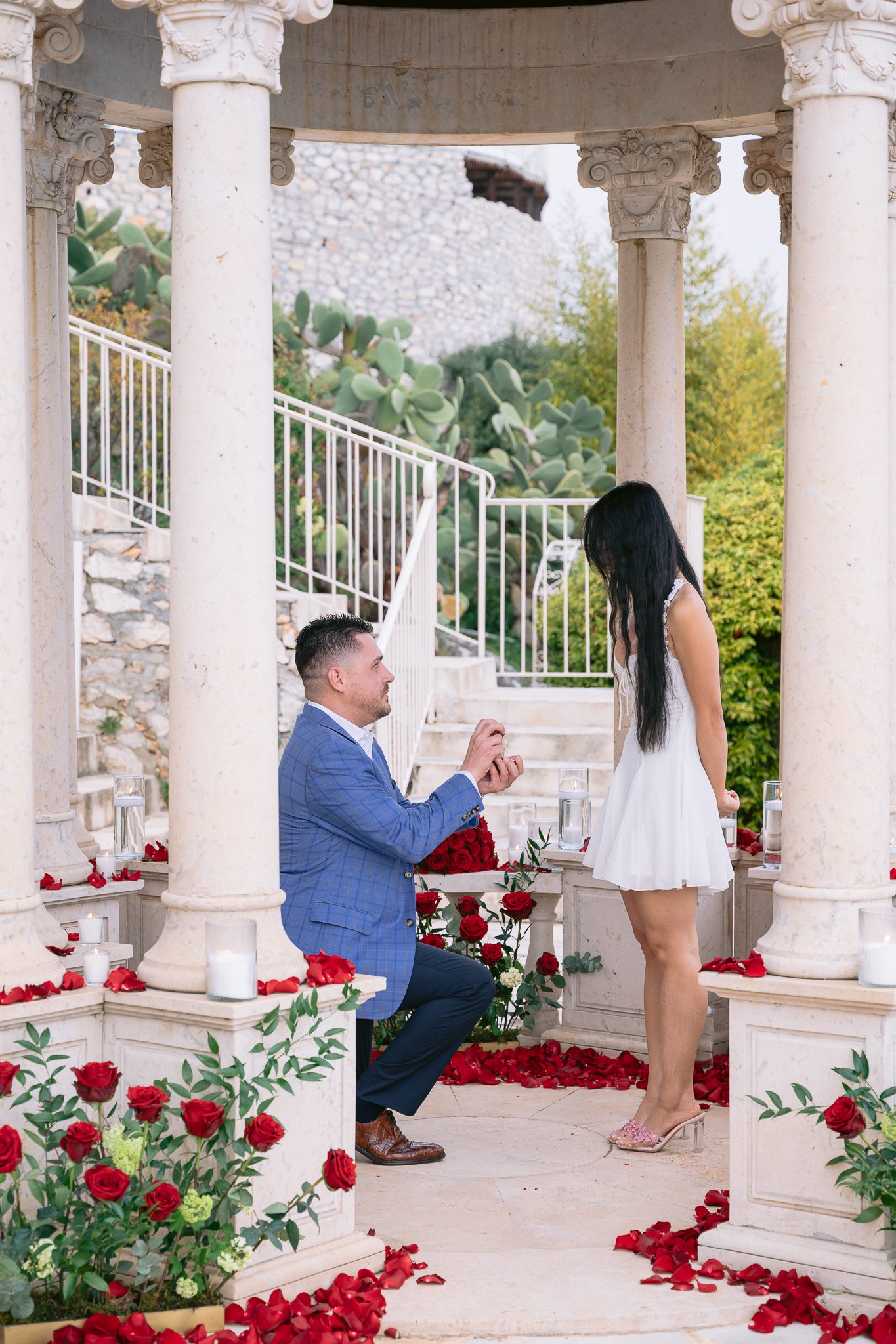 Wedding proposal at La Chèvre d'Or Dome with bouquet of red roses